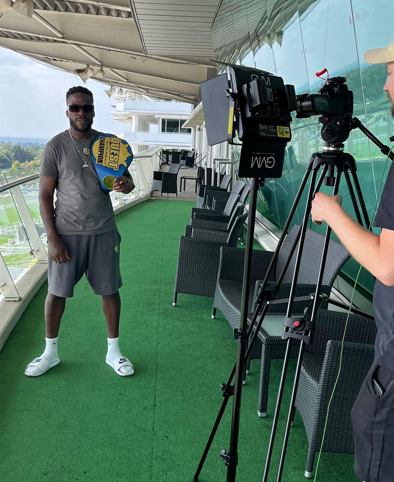 Team Shumba boxer filmed by camera crew during sponsorship event