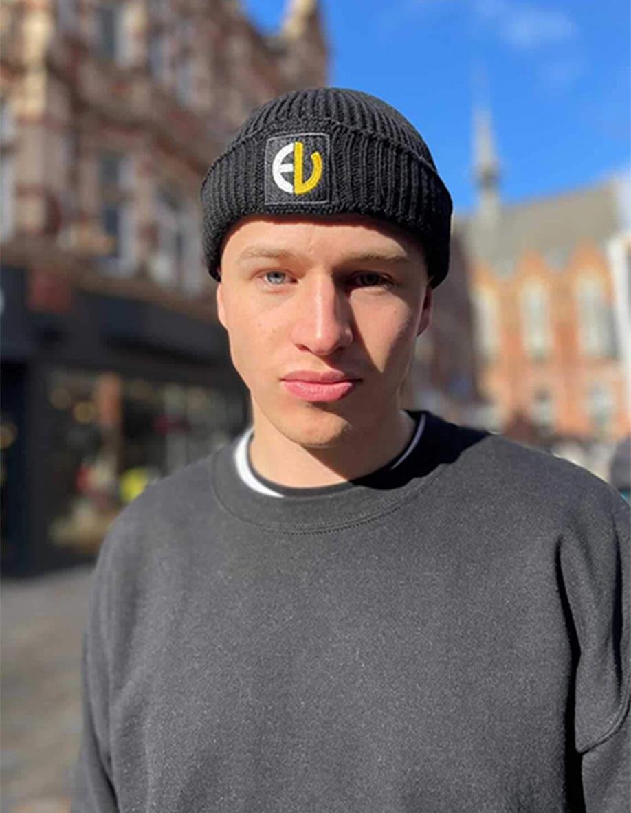 EV Logo Beanie – Black_ EV Clothing black beanie with embroidered yellow logo